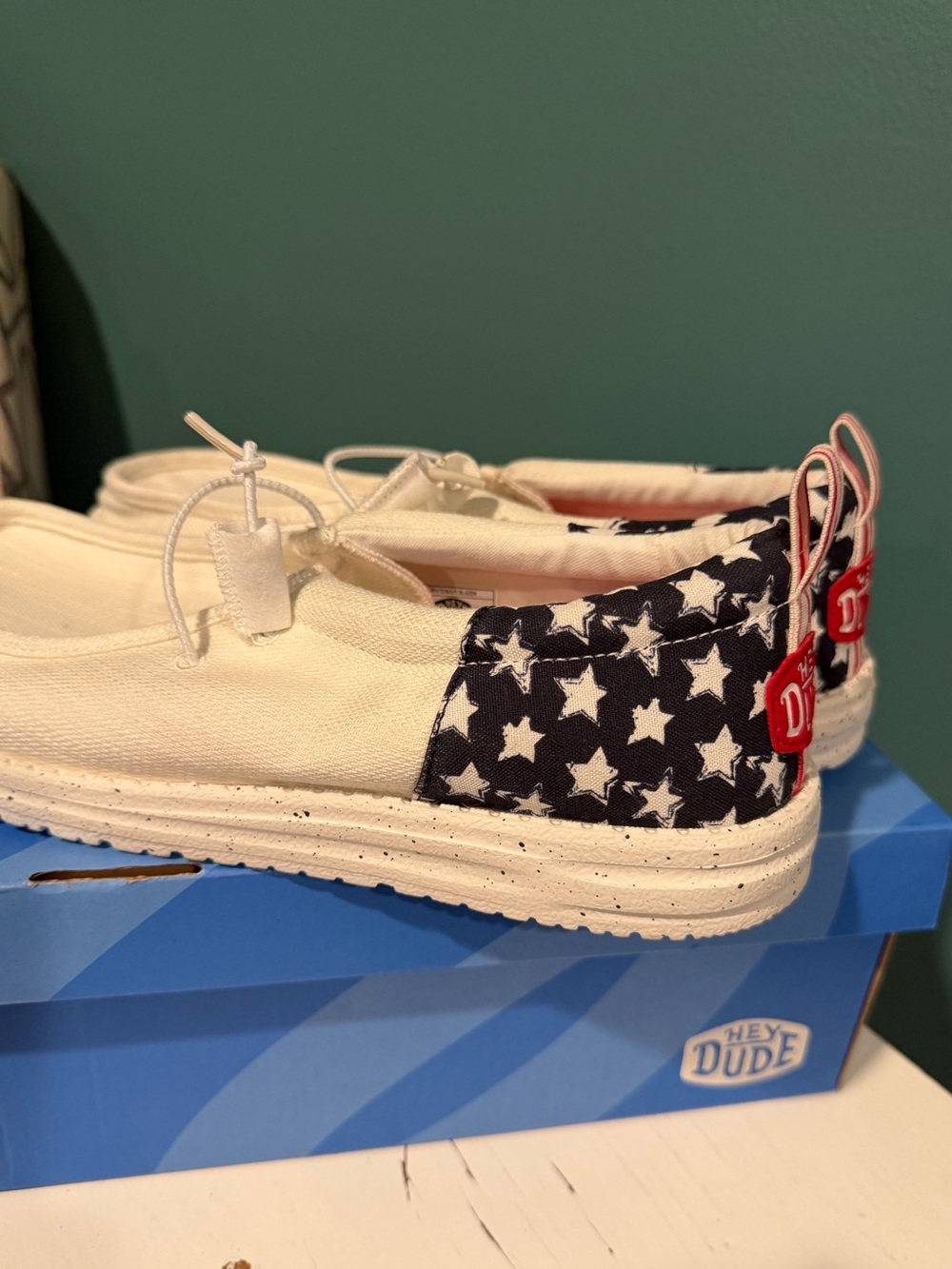 New in box Hey Dude men’s Slip-On Sneakers in Navy, White & Red Star Print